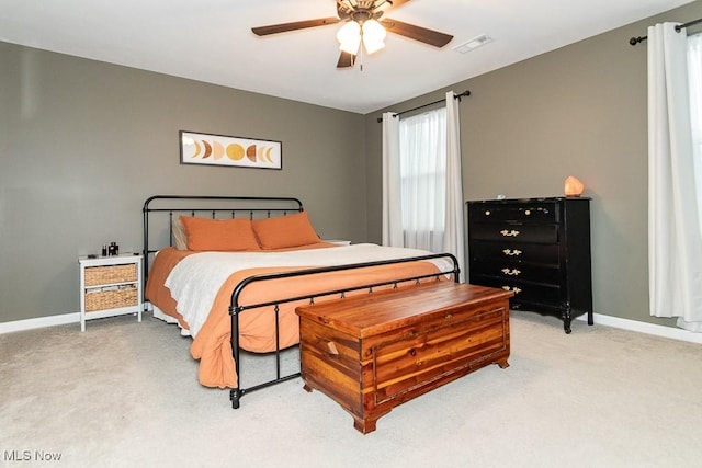 bedroom with ceiling fan and carpet floors