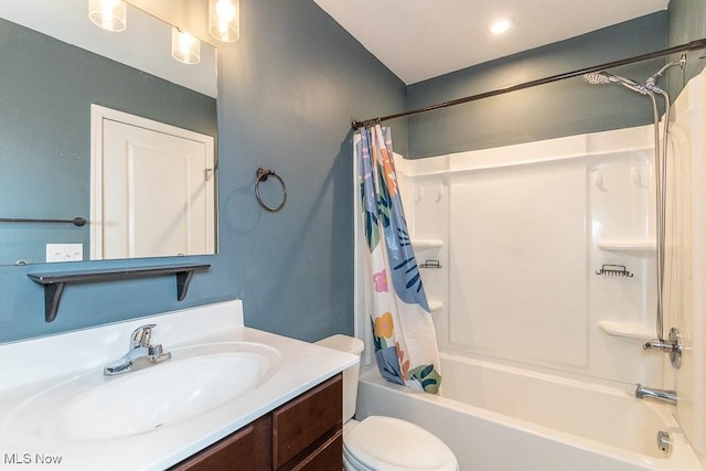 full bathroom with shower / bath combination with curtain, vanity, and toilet