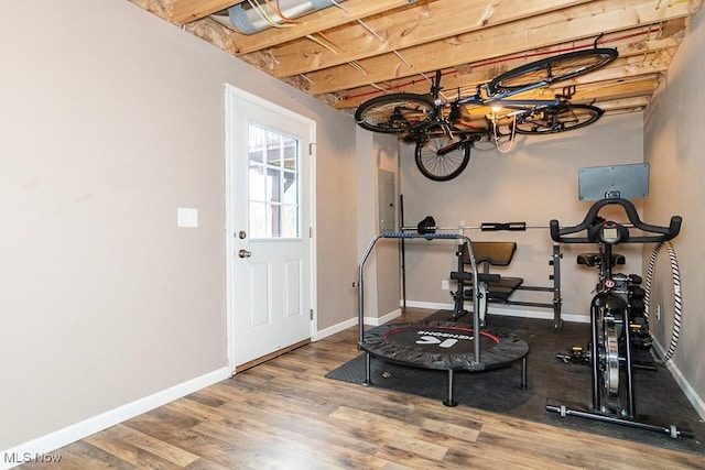 workout room with hardwood / wood-style floors