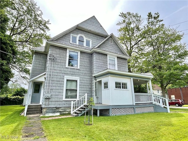 rear view of house with a yard