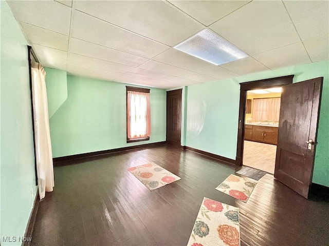 unfurnished room featuring dark hardwood / wood-style flooring