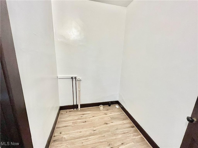 laundry room featuring light hardwood / wood-style floors