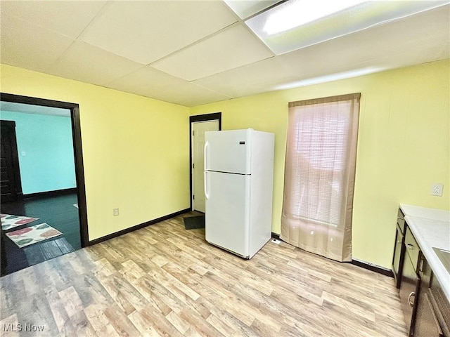 kitchen featuring white fridge and light wood-type flooring