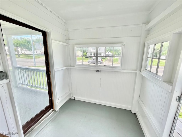 unfurnished sunroom featuring a healthy amount of sunlight