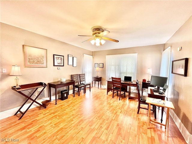 office space featuring light hardwood / wood-style floors and ceiling fan