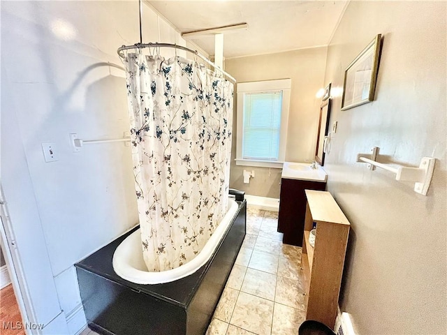 bathroom featuring shower / bath combination with curtain, vanity, and tile patterned floors