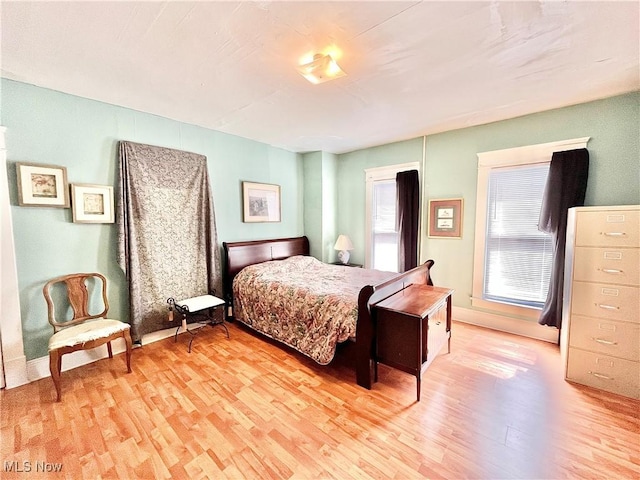 bedroom featuring light wood-type flooring