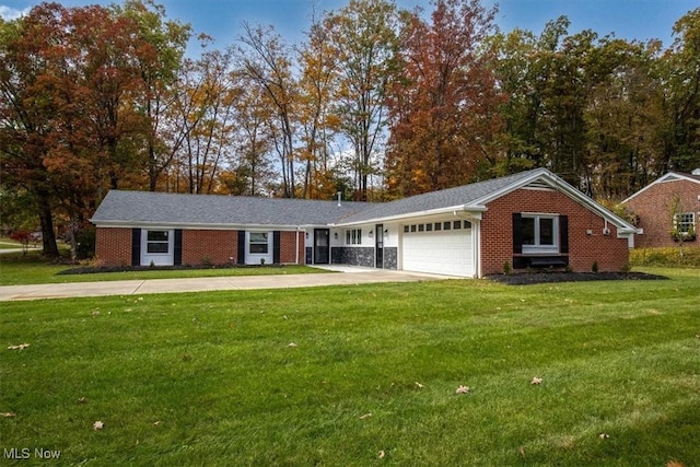 single story home featuring a front yard and a garage