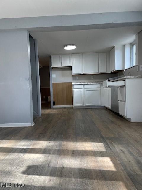 kitchen with white cabinetry and dark hardwood / wood-style floors