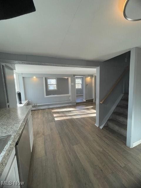 unfurnished living room featuring dark wood-type flooring