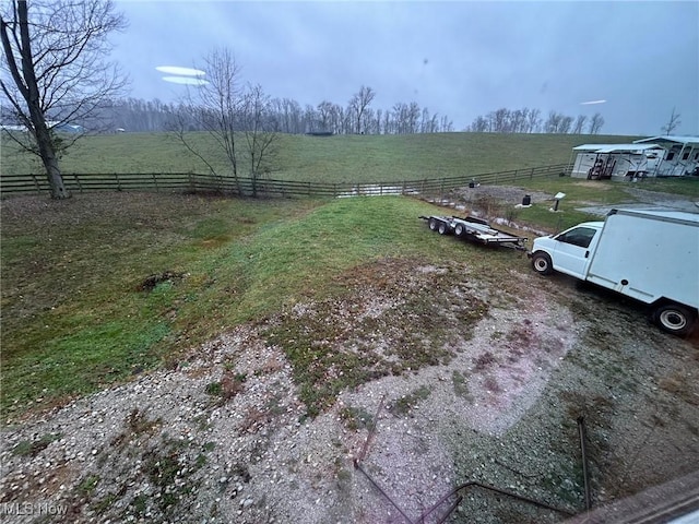 view of yard with a rural view