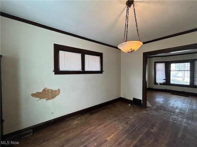 unfurnished room featuring crown molding and dark wood-type flooring