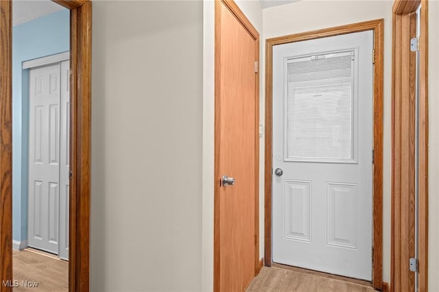 hall with light hardwood / wood-style floors