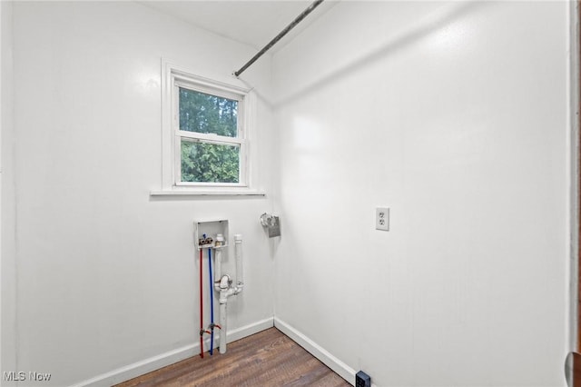 laundry area with dark wood-type flooring and hookup for a washing machine