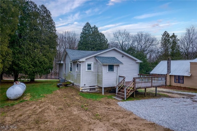 rear view of property with a deck