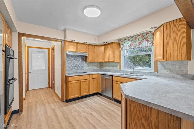 kitchen with black appliances, backsplash, sink, and light hardwood / wood-style flooring