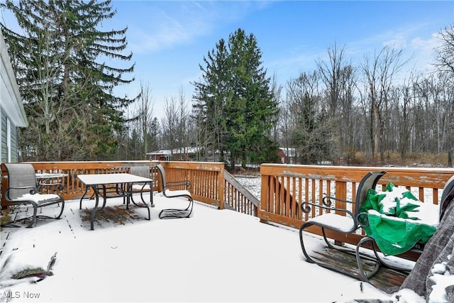 view of snow covered deck