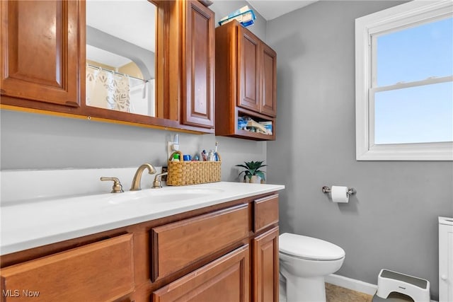 bathroom with vanity and toilet