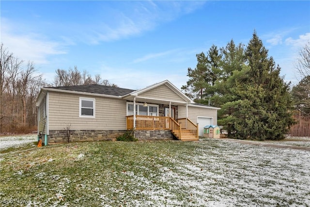 view of front of property with a porch and a garage