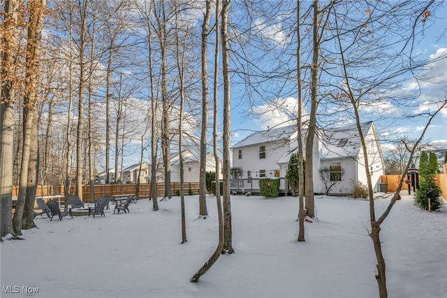 view of yard layered in snow