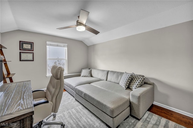 home office with hardwood / wood-style flooring, ceiling fan, and lofted ceiling