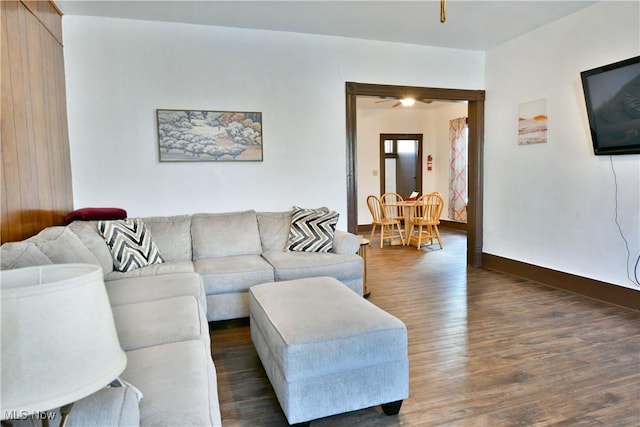 living room with dark hardwood / wood-style flooring