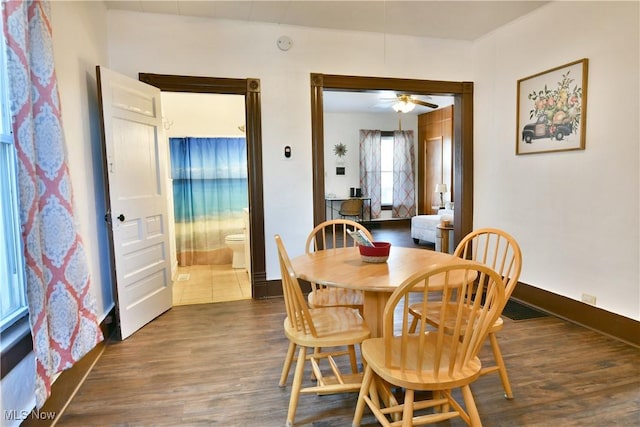 dining area featuring dark hardwood / wood-style floors and ceiling fan