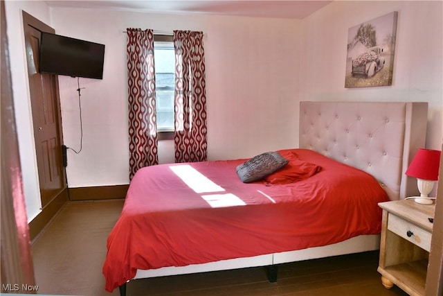 bedroom featuring dark hardwood / wood-style flooring