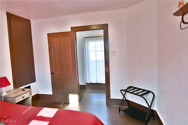 bedroom with hardwood / wood-style flooring