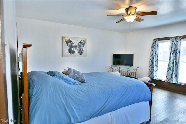 bedroom with ceiling fan and wood-type flooring