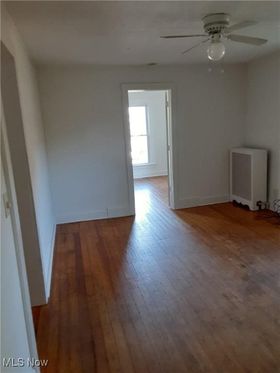 unfurnished room with wood-type flooring and ceiling fan