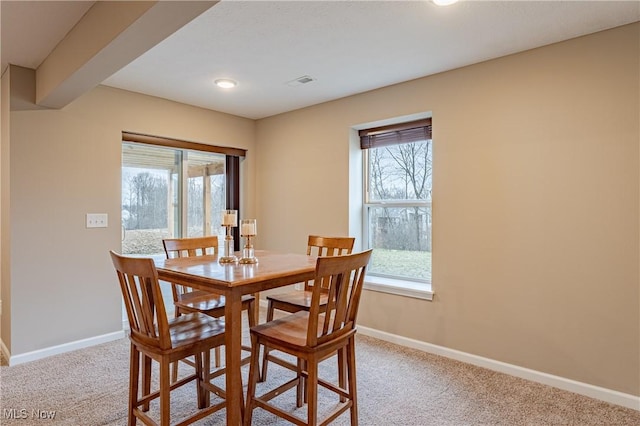 dining area with light carpet