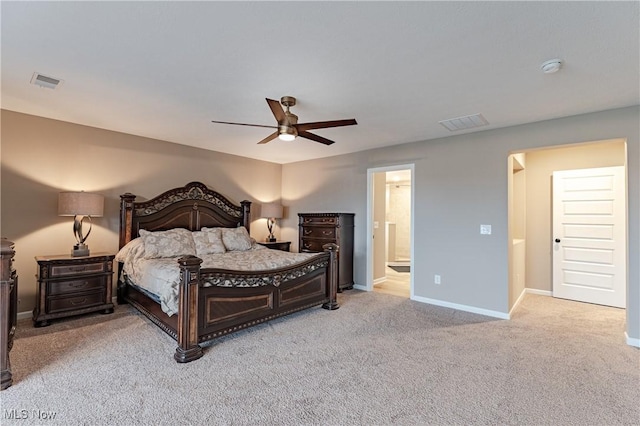 carpeted bedroom with connected bathroom and ceiling fan