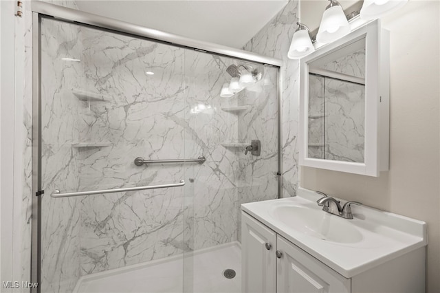 bathroom with vanity and an enclosed shower