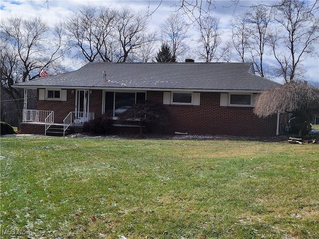 view of front of home with a front lawn