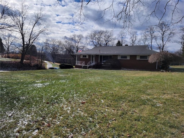 view of front of home featuring a porch and a front yard