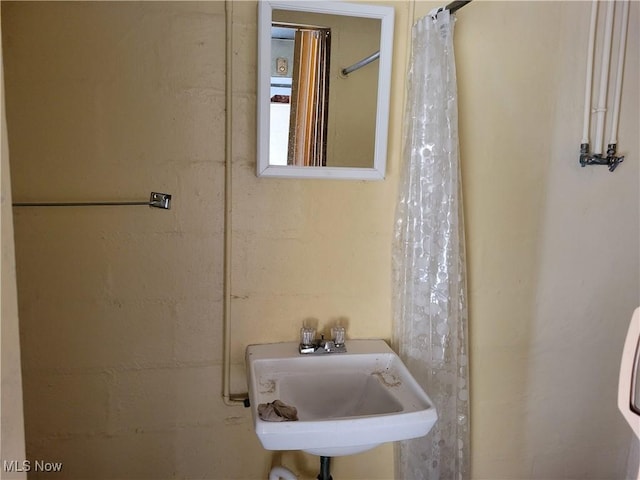 bathroom with sink and walk in shower