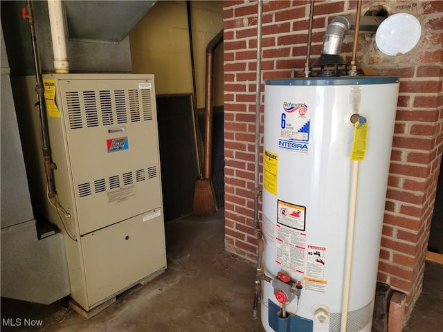 utility room with heating unit and gas water heater