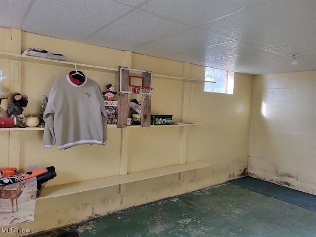 basement featuring a drop ceiling