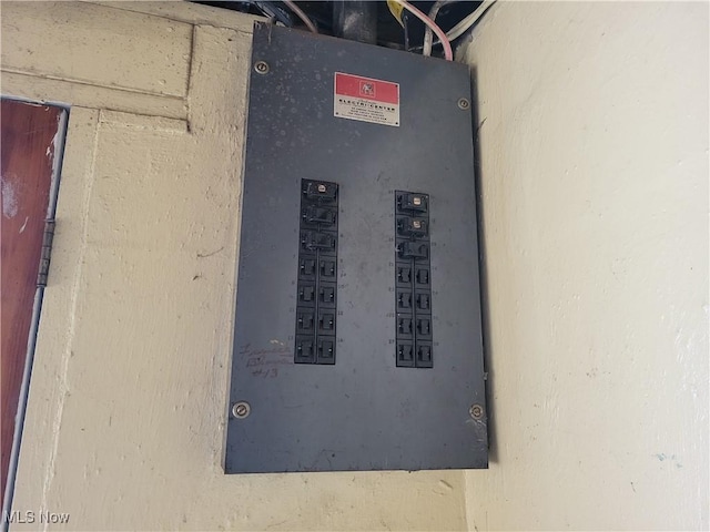 utility room featuring electric panel