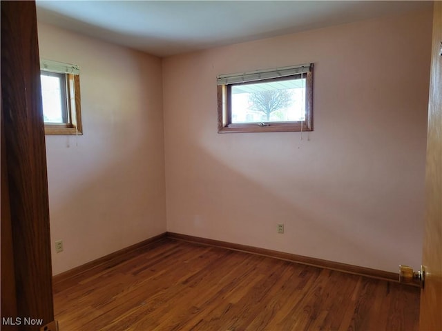 empty room featuring hardwood / wood-style flooring