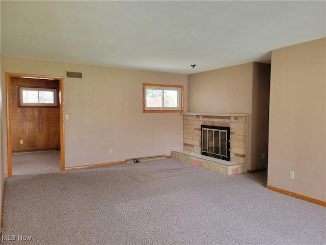 unfurnished living room with light colored carpet