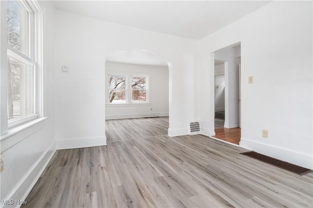 spare room with light wood-type flooring