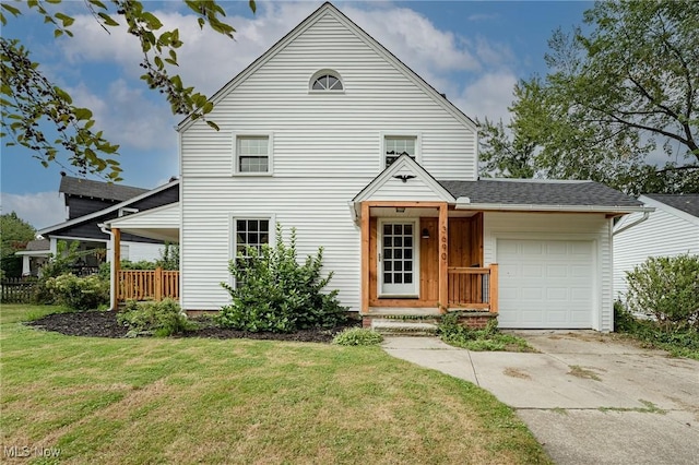 view of front of home with a garage and a front yard