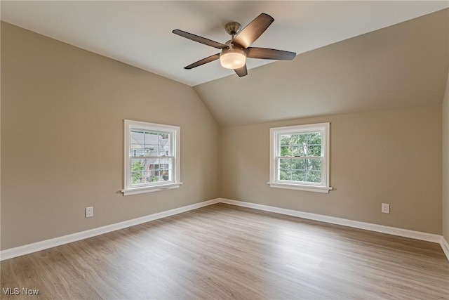 interior space with ceiling fan, light hardwood / wood-style flooring, and lofted ceiling