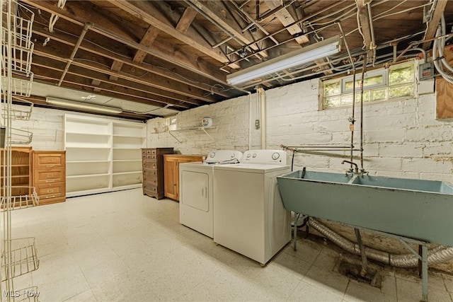 laundry room featuring separate washer and dryer and sink