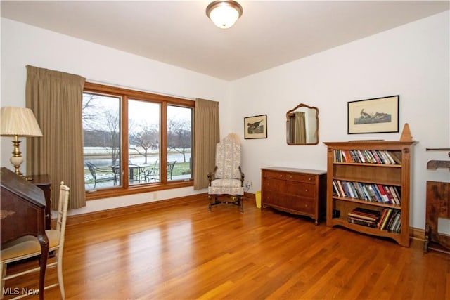 sitting room featuring hardwood / wood-style flooring