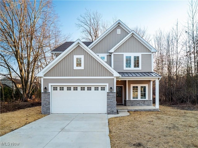 craftsman-style home with a porch, a garage, and a front lawn