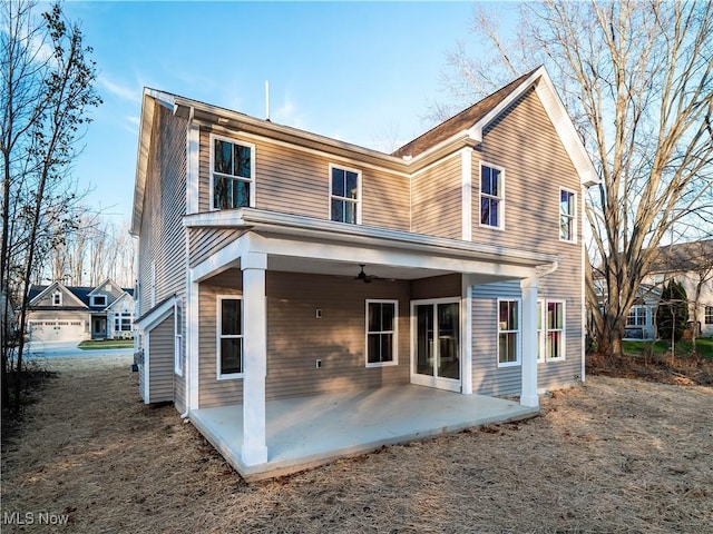 back of property with a patio area and ceiling fan