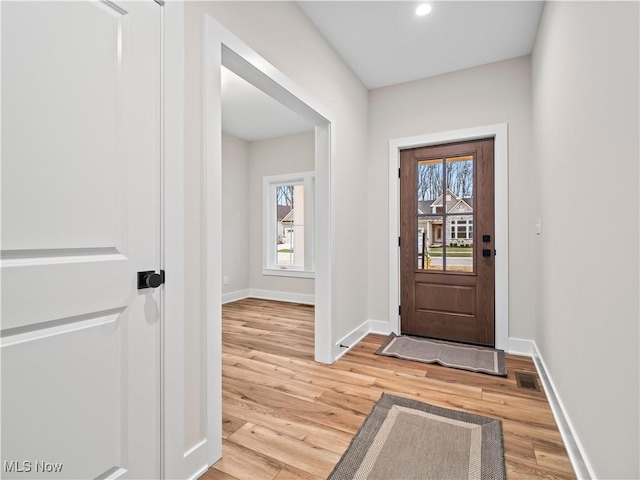 foyer entrance with hardwood / wood-style floors